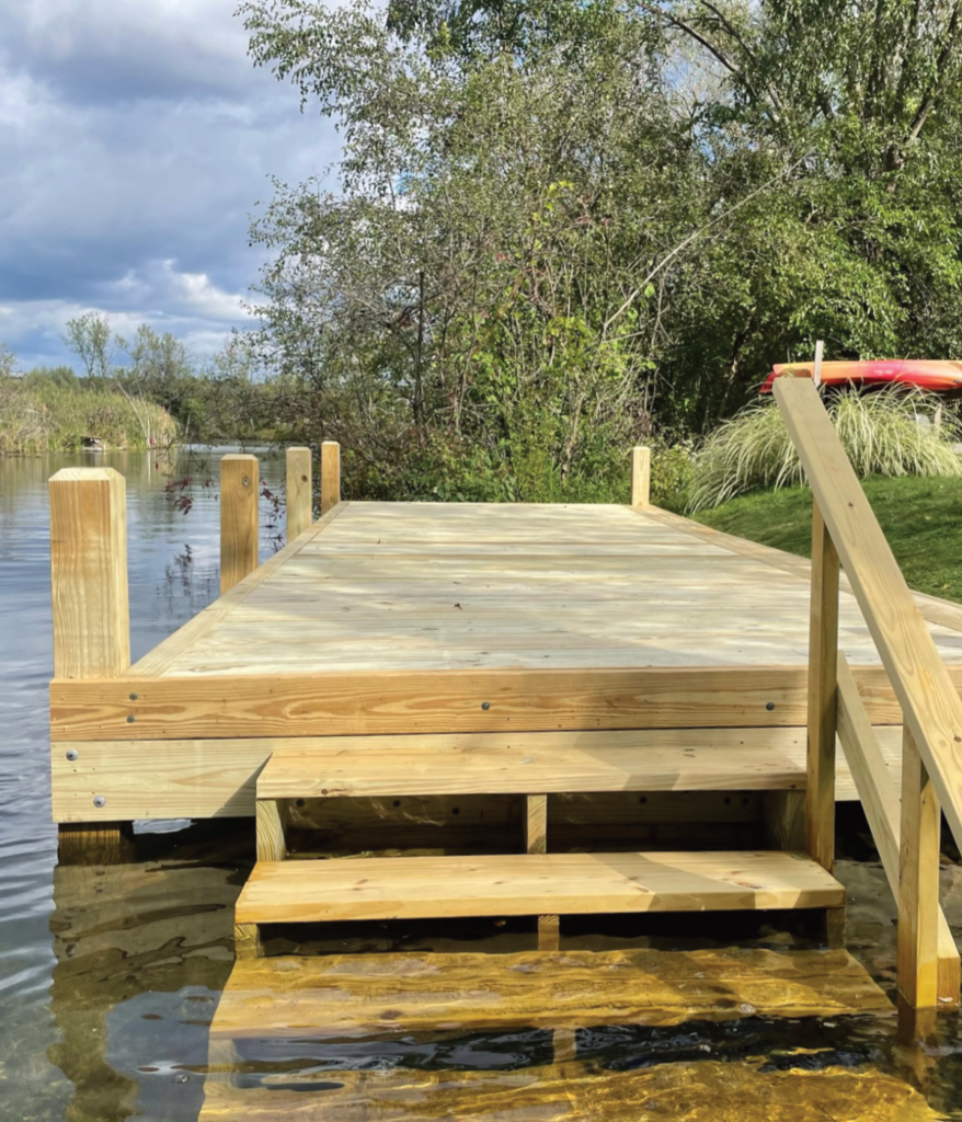 Wood dock with stairs into the water for convenience