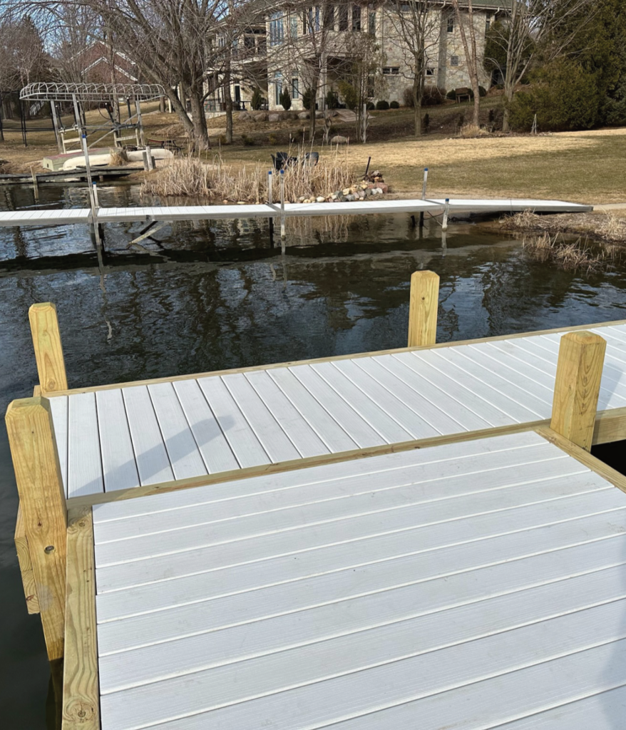 White composite decking tops on a wood pier