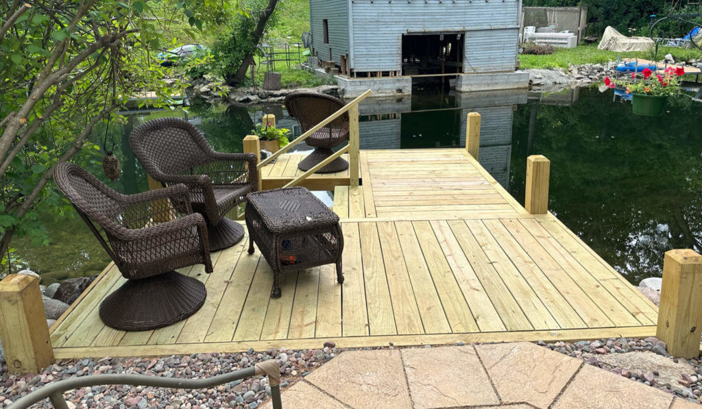 Wood dock on the Oconomowoc river.