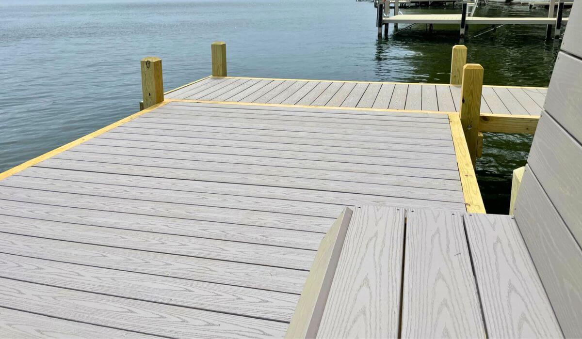 Custom built sunbathing platform with composite dock decking.