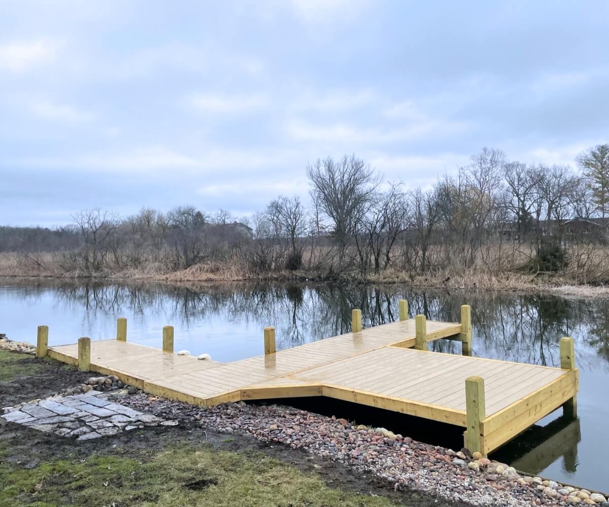 Custom-designed wood dock with angled platform on Nagawicka Lake in Southern Wisconsin.