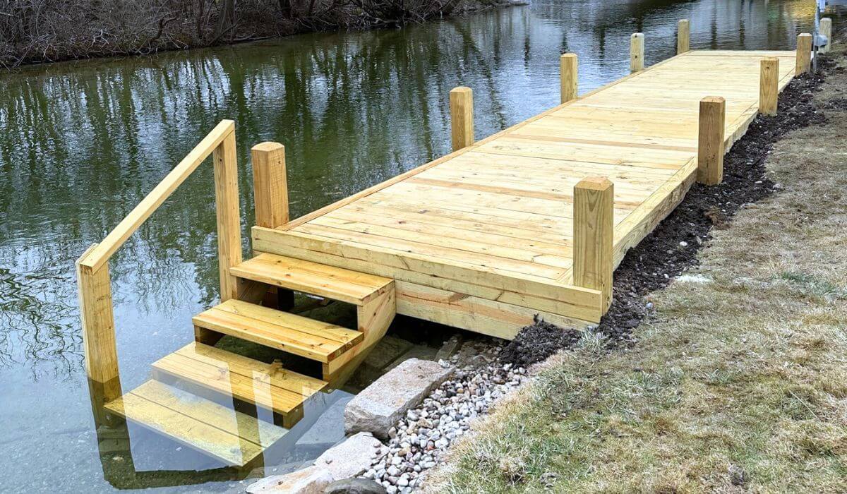 Custom built wood dock designed into the shoreline for riverfront properties.