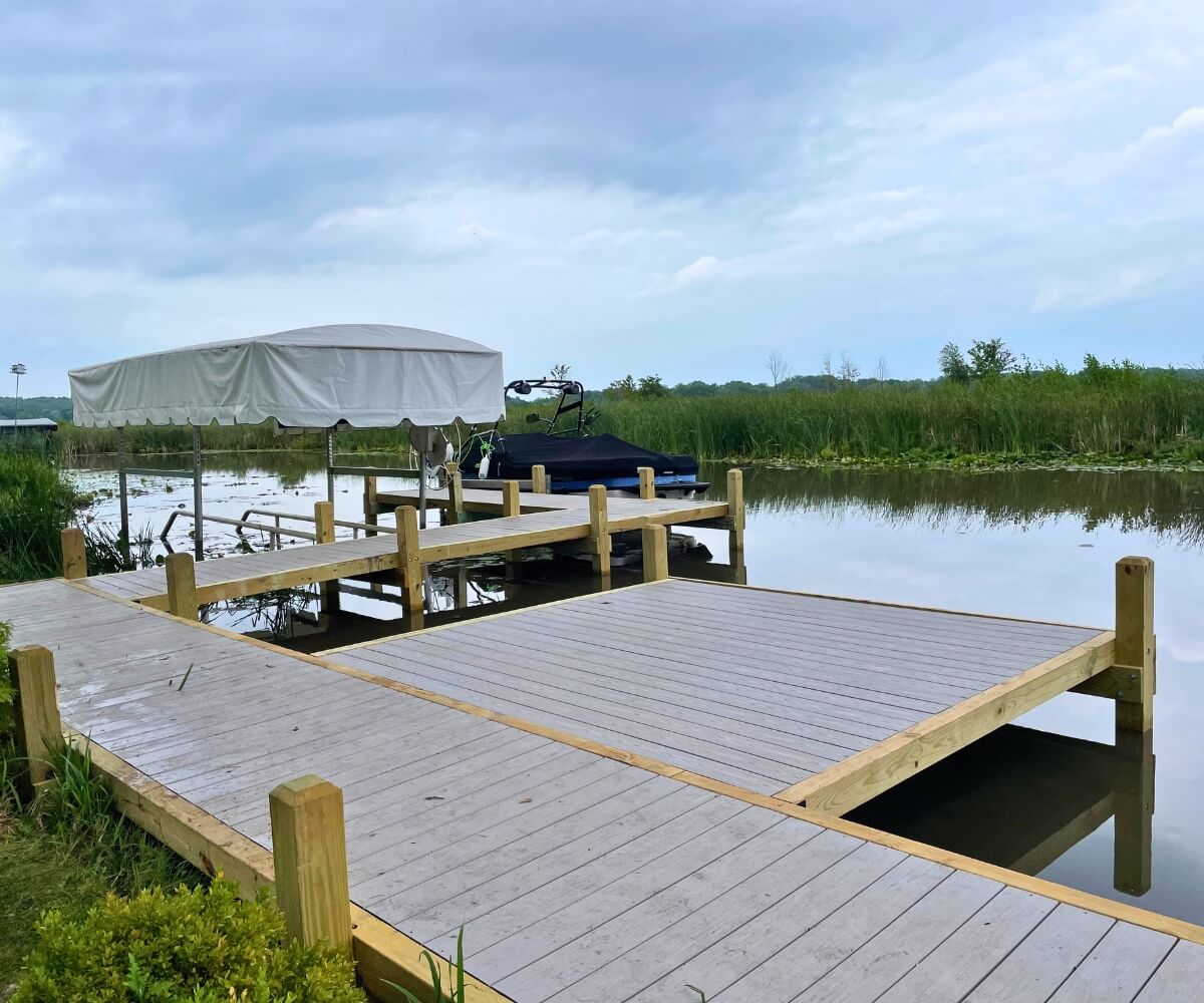 Large custom wood dock with sunbathing platform on Nagawicka Lake in Southern Wisconsin.