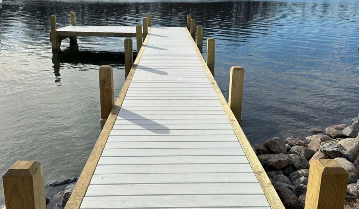 Simple L shape dock featuring white composite decking on Moose Lake, Wisconsin.