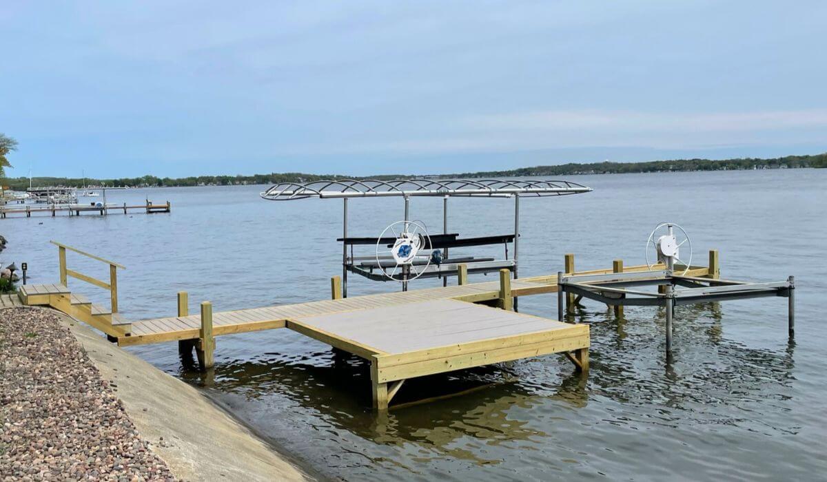 Pewaukee Lake dock featuring tanning platform